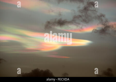 Bizarre lighting effects in nacreous clouds at sunset over Ambleside, caused by refraction off ice crystals in high clouds affec Stock Photo