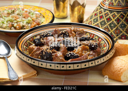 Traditional Moroccan dish with meat, plums and sesame seeds close up Stock Photo