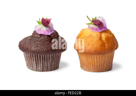 Cupcakes with fresh Sweet pea flowers on white background Stock Photo