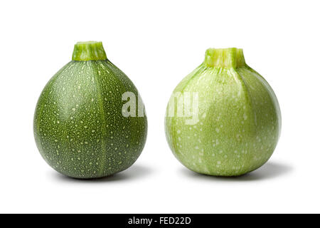 Two fresh green round Zucchini on white background Stock Photo