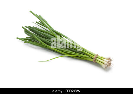 Bunch of small fresh green spring onions on white background Stock Photo