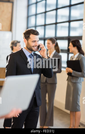 Businessman using his smart phone Stock Photo