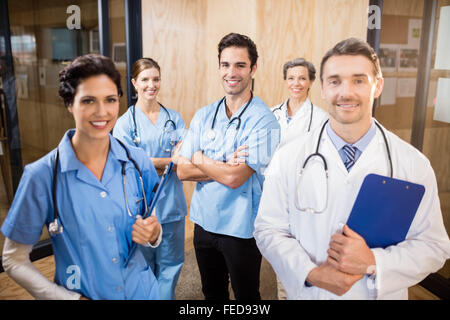 Medical team smiling at camera together Stock Photo