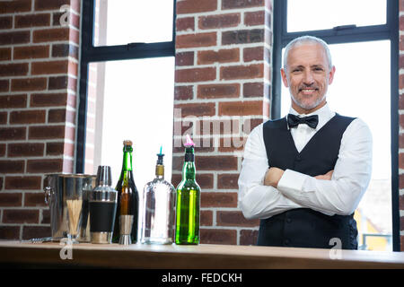 Bar tender crossing arms Stock Photo