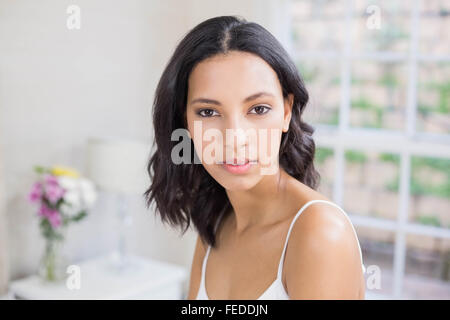Pretty brunette smiling to the camera Stock Photo