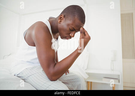 Handsome man having headache Stock Photo