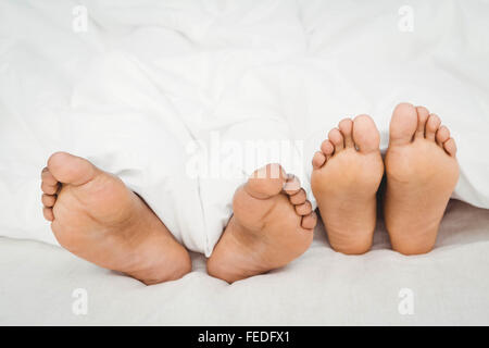 Close up of couples feet Stock Photo