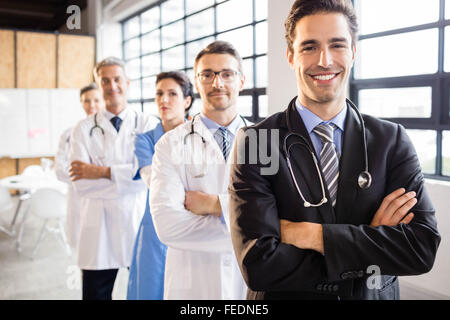 Medical team smiling at camera together Stock Photo