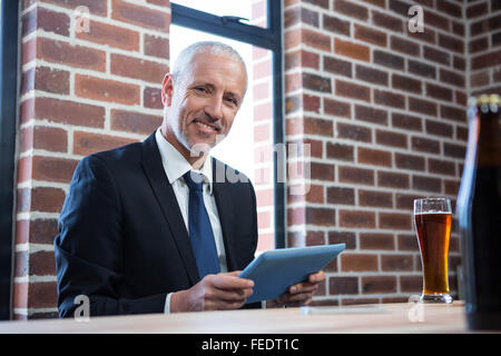 Businessman using tablet Stock Photo