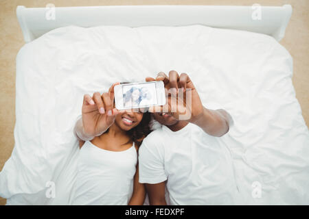 Ethnic couple taking selfie Stock Photo