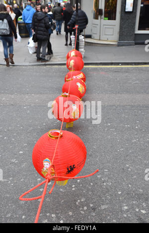 Charing Cross Road, London, UK. 5th February 2016. Chinatown prepares for the New Year celebrations as decorations are put up Stock Photo