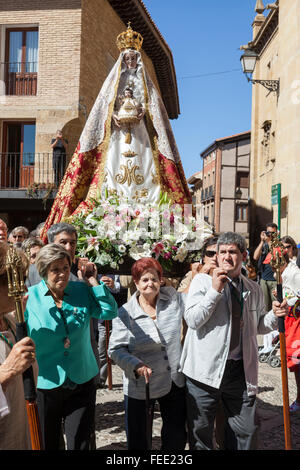Locals carry the statue of the Virgin Mary in the Procession of Thanksgiving