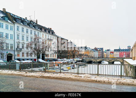 COPENHAGEN, DENMARK - JANUARY 5, 2011: Waterfront and bridges in Copenhagen in winter. Copenhagen is the capital and most populated city in Denmark. It connects the North sea with the Baltic sea. Stock Photo