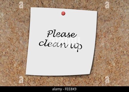 please clean up written on a memo pinned on a cork board Stock Photo