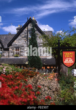 Betws-y-Coed Betws y Coed Grove House B&B bed and breakfast house exterior accommodation with flowers in garden in foreground Co Stock Photo