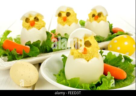 Fun Easter breakfast of hatching chicks made of boiled eggs Stock Photo