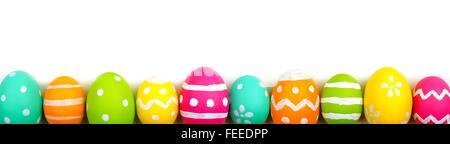 Colorful long Easter egg border against a white background Stock Photo