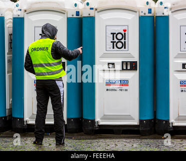 Mobile toilette cabins during street carnival in the old town, Cologne, Germany,