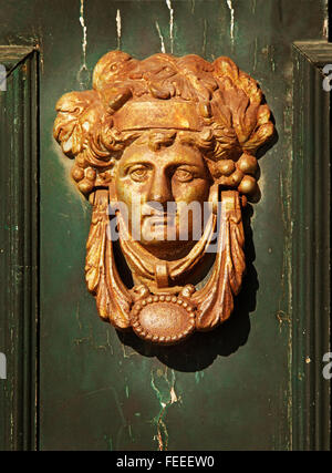 Metal antique door knocker in the form of a female head, Porto, Portugal Stock Photo