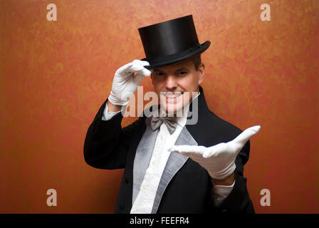 Magician performing a magic trick Stock Photo