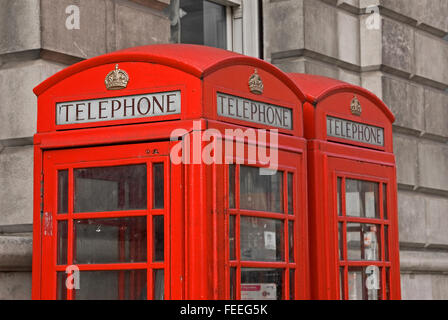 Pair of iconic red telephone boxes or kiosks, stand on Whitehall in central London Stock Photo