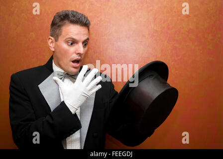 Magician performing a magic trick Stock Photo