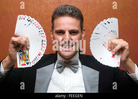 Magician make performance with card deck Stock Photo