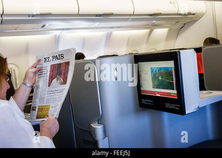 Spain,Europe,European,Spanish,MAD,Adolfo Suárez Madrid-Barajas Airport,onboard,business class,cabin,Iberia flight 6165,video monitor,commercial plane, Stock Photo