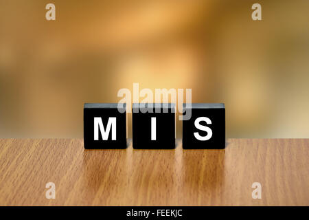 MIS or Management Information Systems on black block with blurred background Stock Photo
