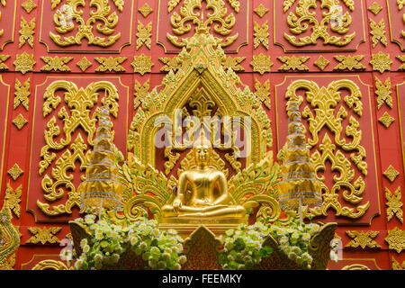 Big buddha statue on red background in wat  Lahan Rai, Rayong, Thailand. Stock Photo