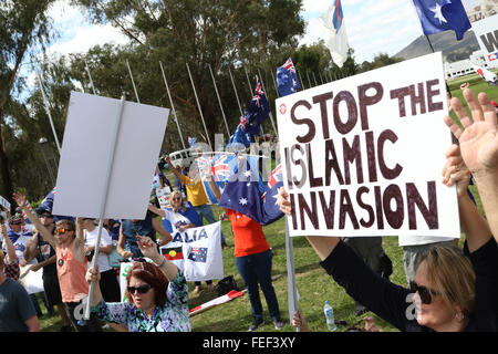 Canberra, Australia. 6 February 2016. Pictured: A protester holds a sign saying, ‘Stop the Islamic invasion’ at the rally outside the Australian Parliament House in Canberra. A rally billed as ‘Save our country, save our culture, save our future’ was held in the nation’s capital Canberra as part of the international day of protests by the PEGIDA movement, which is against the Islamification of the western world. Credit:  Richard Milnes/Alamy Live News Stock Photo