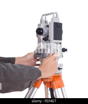 hand working with survey equipment theodolite on a tripod. Isolated on white background Stock Photo