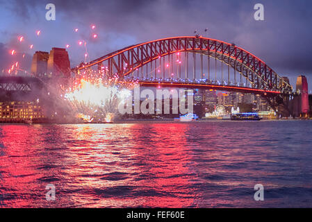 Sydney, Australia. 6th February, 2016. The Sydney Harbour Bridge is lit red and with Chinese style fireworks the Chinese new year - the monkey - is celebrated. Credit:  Duncan Sharrocks/Alamy Live News Stock Photo