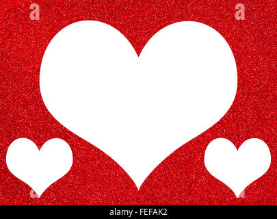One large heart and two small on a red Textured, glitter background with copy space lots of room for text ,ideal for Valentine's Stock Photo