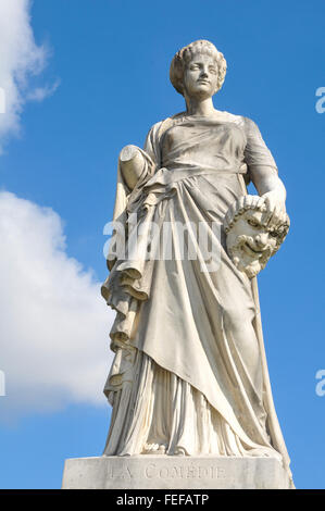 Statue depicting Comedy with mask in Paris, France Stock Photo