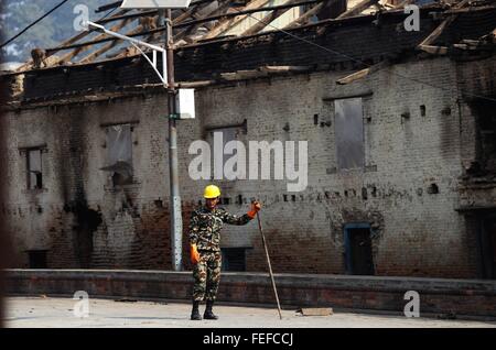 Kathmandu, Nepal. 6th Feb, 2016. A Nepal Army stands as demolishing houses damaged by earthquakes and aftershocks at Pashupatinath premises in Kathmandu, capital of Nepal, Feb. 6, 2016. An aftershock of 5.5 magnitude was felt in Kathmandu and many districts of the Central Nepal at 10 p.m. local time on Friday night. This was one of the strong aftershocks felt in Nepal after the 7.9 magnitude jolted the country on April 25 last year which claimed around 10,000 lives, leaving thousands injured. © Sunil Sharma/Xinhua/Alamy Live News Stock Photo