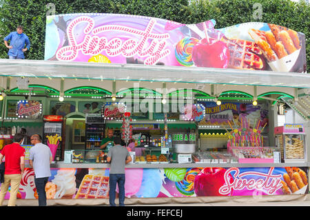 Paris, France - July 9, 2015: Tourists buy confectionery products at sweets shop in amusement park in Paris Stock Photo