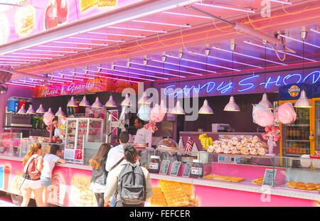 Paris, France - July 9, 2015: Tourists buy confectionery products at sweets shop in amusement park in Paris Stock Photo
