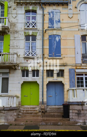 Wimereux, Derelict French house frontage with shuttered windows and peeling paint. Stock Photo