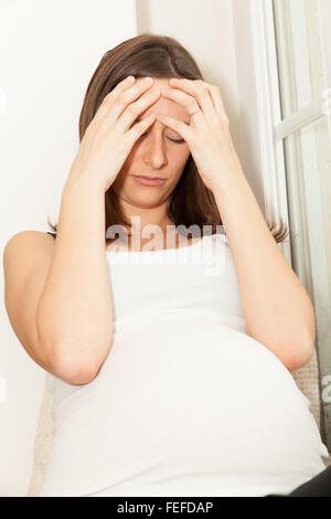 sad pregnant woman Stock Photo