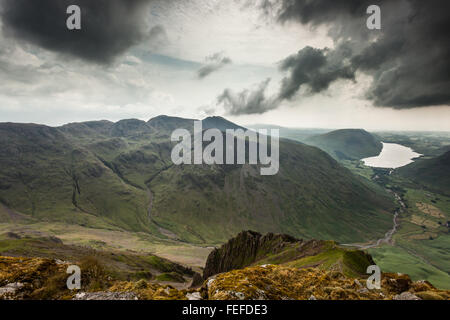 Looking across to the Scafell pike mountain range from the westmorland memorial cairn on great gable. Stock Photo