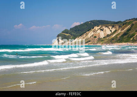 Agios Stefanos (west), Corfu, Ionian Islands, Greece. View across rough turquoise sea, waves rolling in. Stock Photo