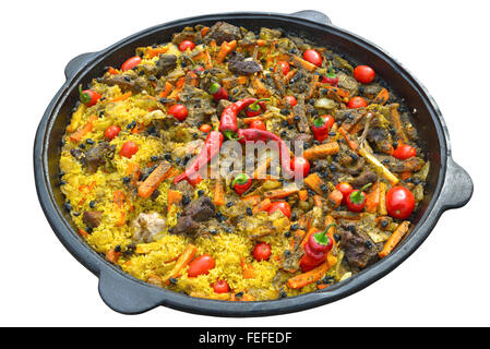 Pilaf with meat, spices, garlic and red pepper, cooked over a fire in a cast iron cauldron. Isolated on white background