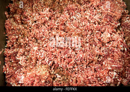 Freshly prepared spicy mince meat mixture for making salami in a butchery with ground beef and pork Stock Photo