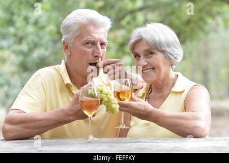 Old couple drinking wine Stock Photo