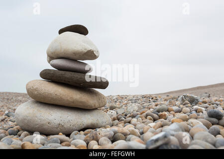 low angle shot of a pile of stones on a stony beach Stock Photo