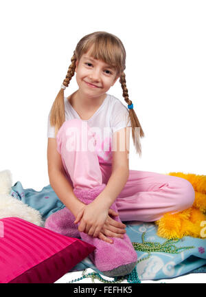 Cute girl in pink pajamas smiling isolated on white Stock Photo - Alamy