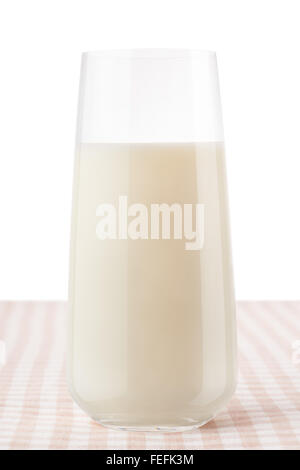 Glass of milk on classic brown and white checkered tablecloth, isolated on white background, including clipping path Stock Photo