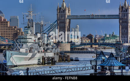 Tower Bridge, London, with HMS Belfast moored on The River Thames in the foreground Stock Photo