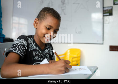 Boy, 10 years, drawing, social project Cresciendo Unidos, Javier Villa, Bogota, Colombia Stock Photo